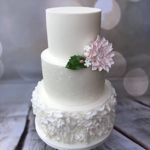 3 tier wedding cake with glitter, ruffles and hand made dahlia 